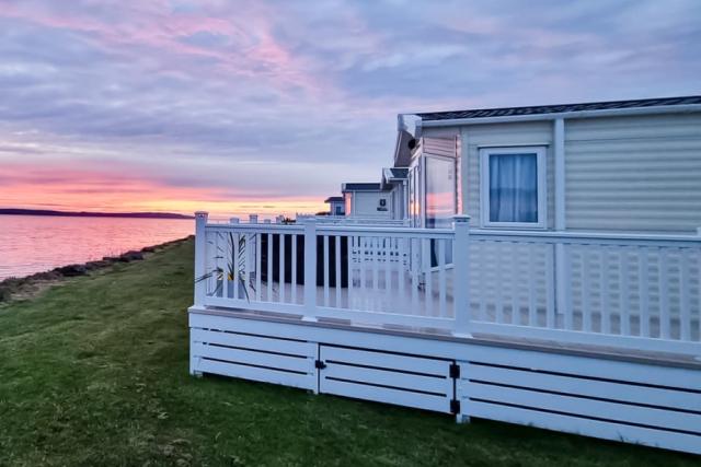 caravans with outdoor decking at ryan bay holiday park in stranraer