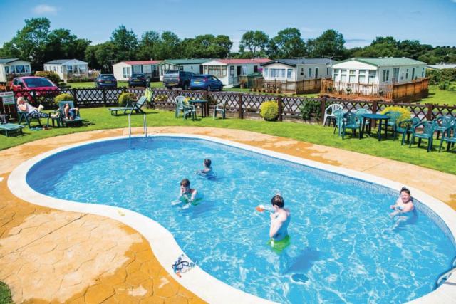 outdoor swimming pool at the village holiday park in new quay