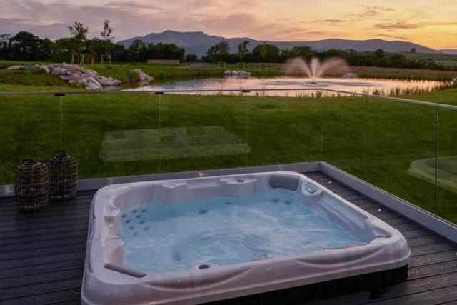 hot tub lodges by the lake at Whitbarrow