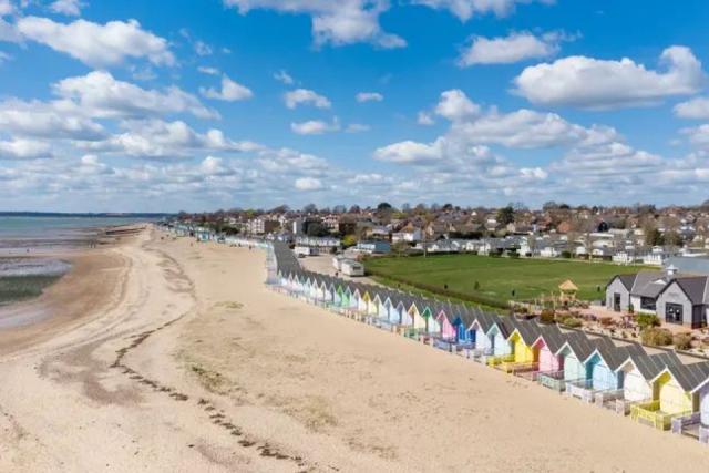 West Mersea Holiday Park by the beach and beach huts on Mersea Island