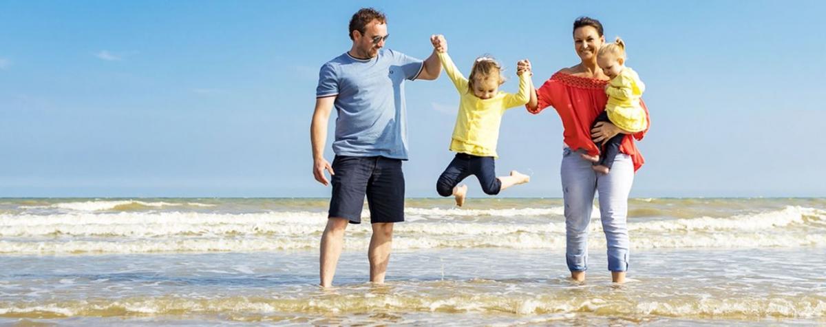 A family on the beach at the best caravan parks in Kent