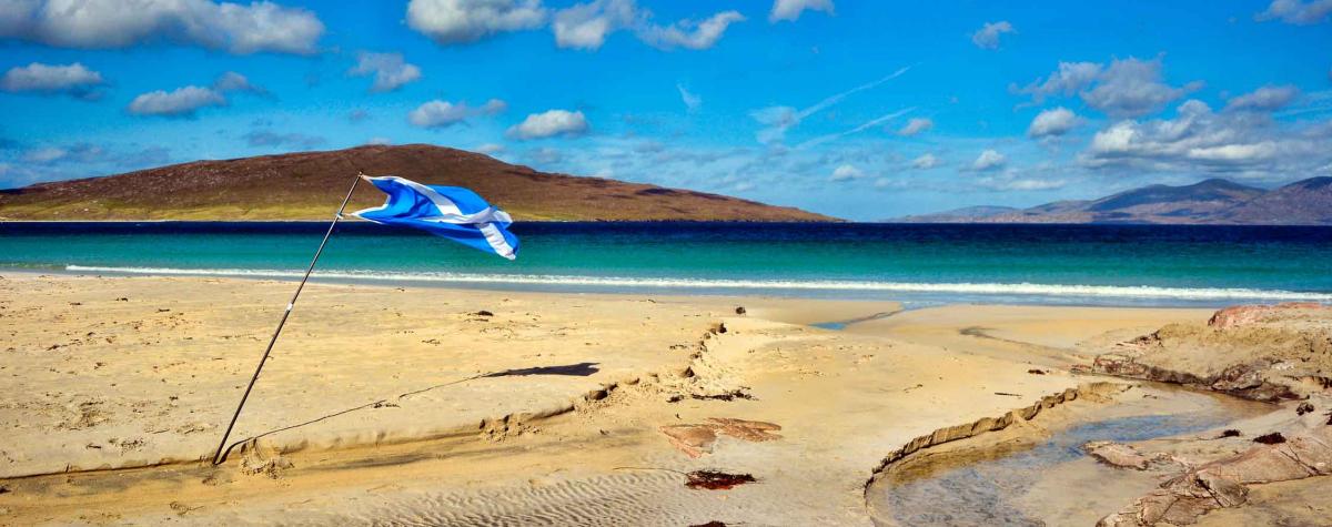 A deserted beach, seaside caravan parks in Scotland