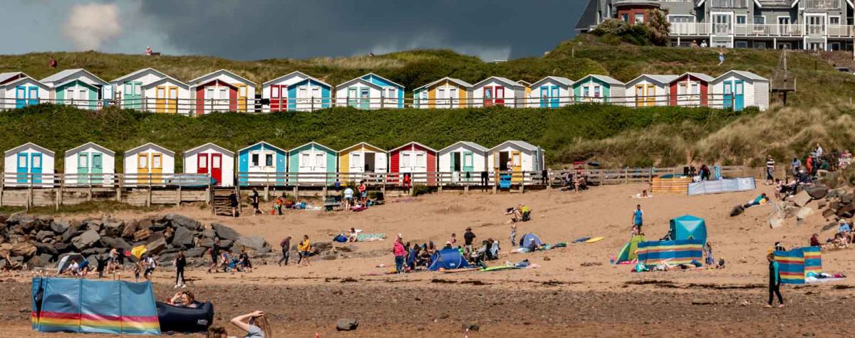 People on a Bude Beach and Caravan Parks in Bude
