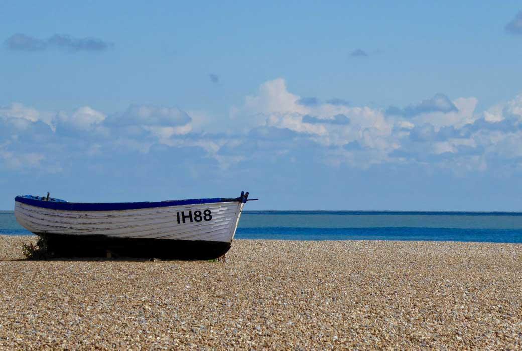 A Sea Rowing Boat on a Empty Beach
