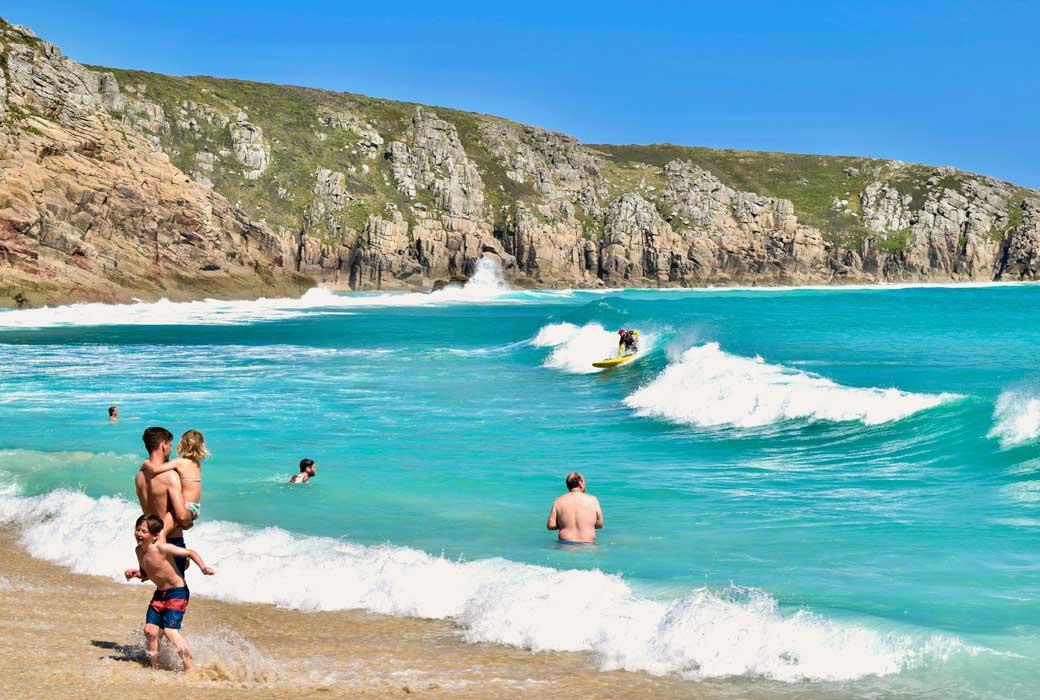 People Paddling, Swimming and Surfing on a Cornish Beach