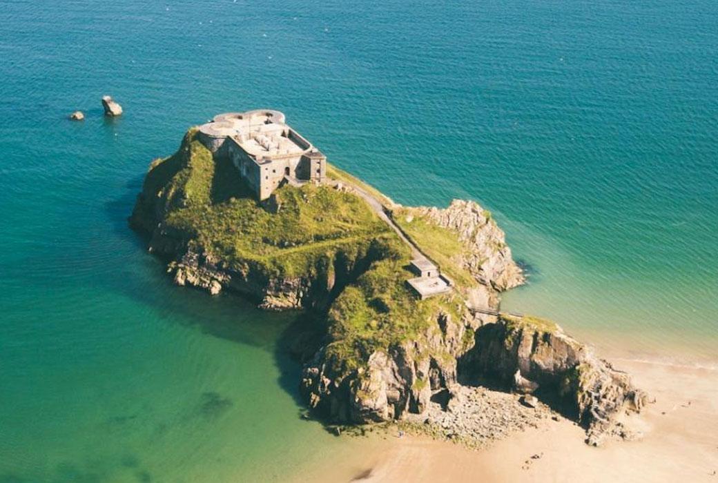 Castle on a Island near to a Welsh Beach