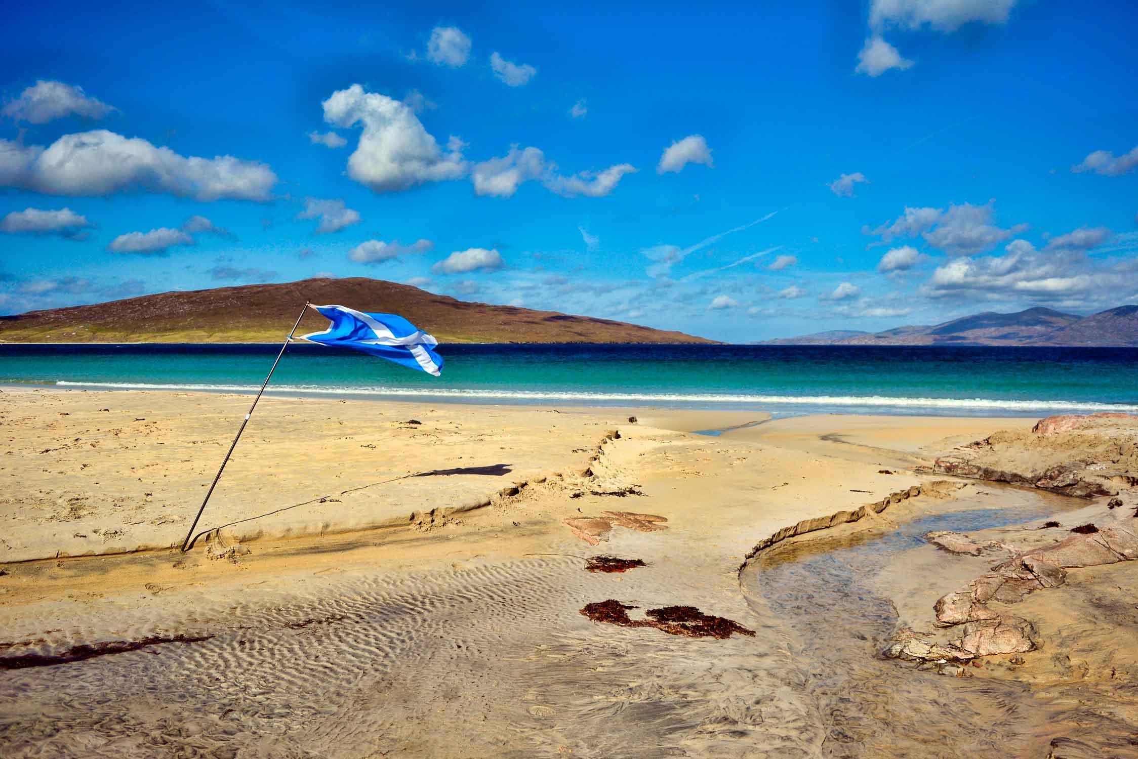 A Scottish Flag in the sand on a Beach