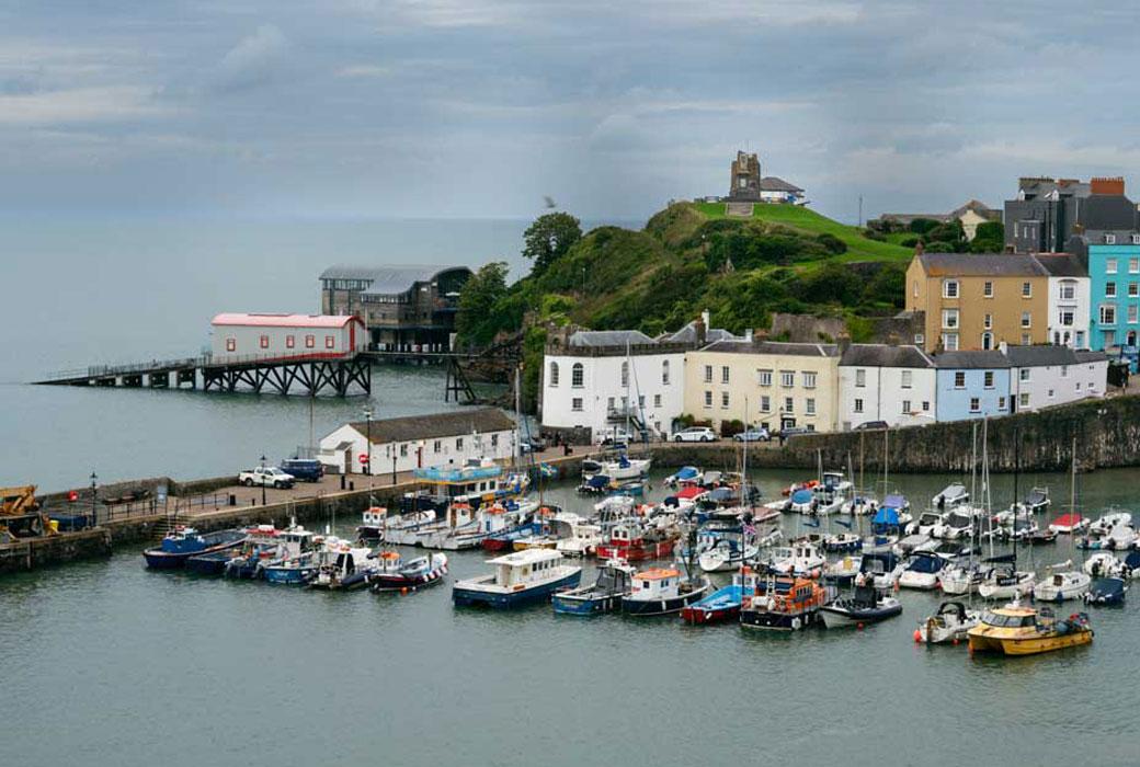 A Coastal Town with Multi Coloured Boats & Houses