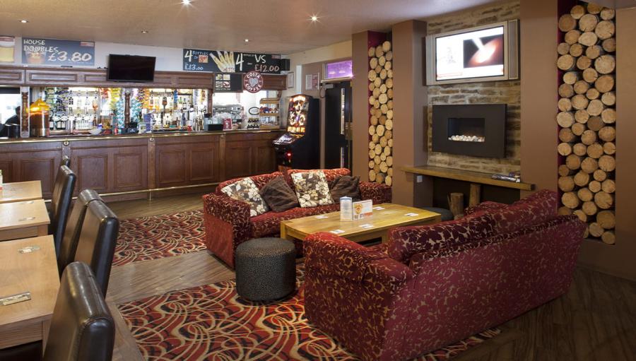 by the bar at Looe Bay Holiday Park