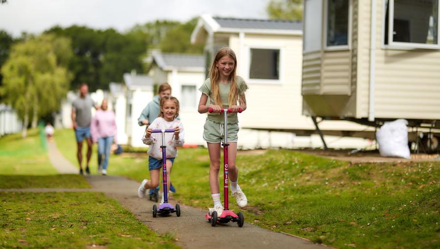 Languard Holiday Park kids playing by caravans