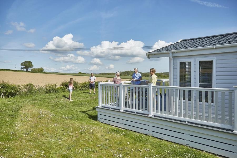 Lower Hyde Holiday Park lodges overlooking a field
