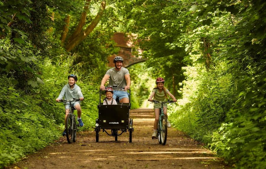 families biking in the woods