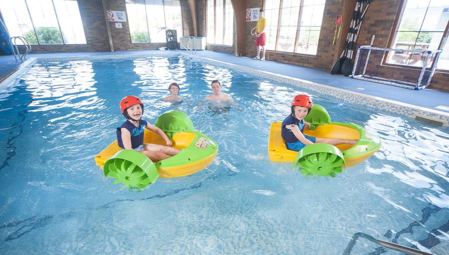 fun on the inflatables in the indoor pool