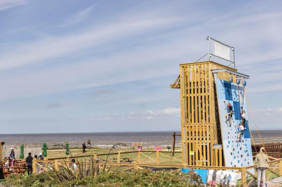 the climbing wall by the beach at Doniford Bay Holiday Park