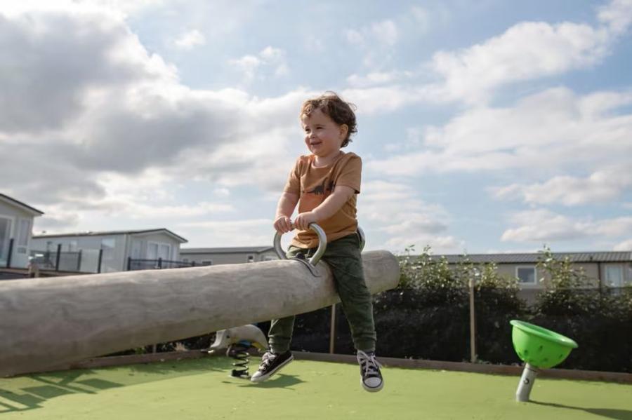 on the seasaw at Reighton Sands Holiday Park