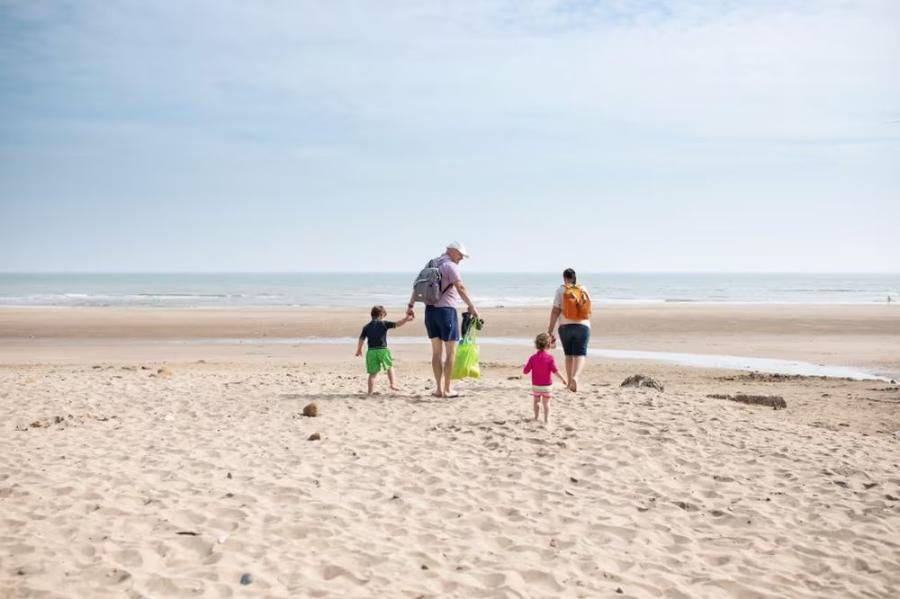 enjoying a walk at Reighton Sands Holiday Park on the beach