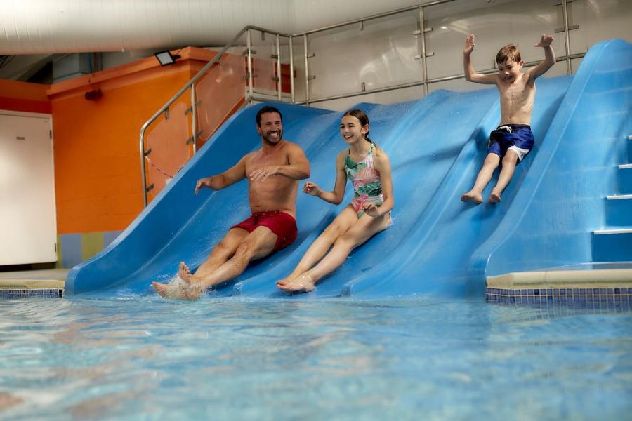 indoor swimming pool with slides at Nodes Point Holiday Park