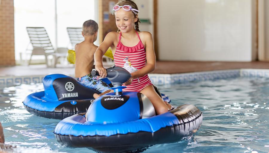 inflatable jet skis in the pool at Romney Sands Holiday Park