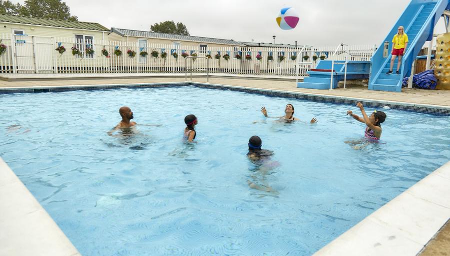 enjoying the outdoor pool at California Cliffs Holiday Park