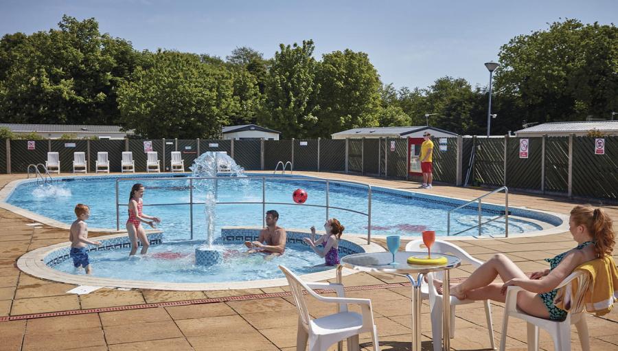 the outdoor pool with water features at Cherry Tree Holiday Park