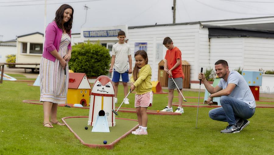 playing crazy golf on holiday at Heacham Beach Holiday Park