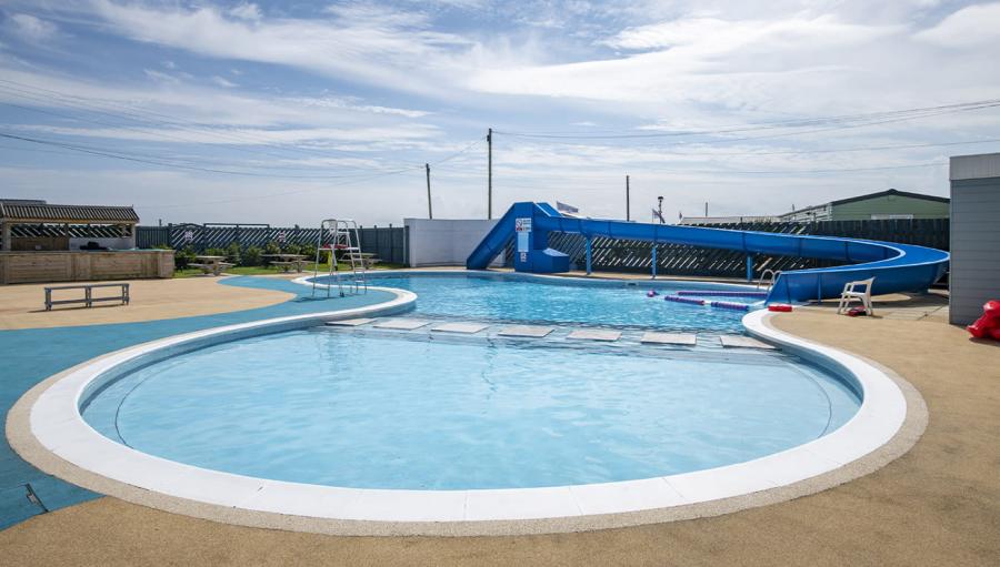 outdoor swimming pool with flume at Barmston Beach Holiday Park