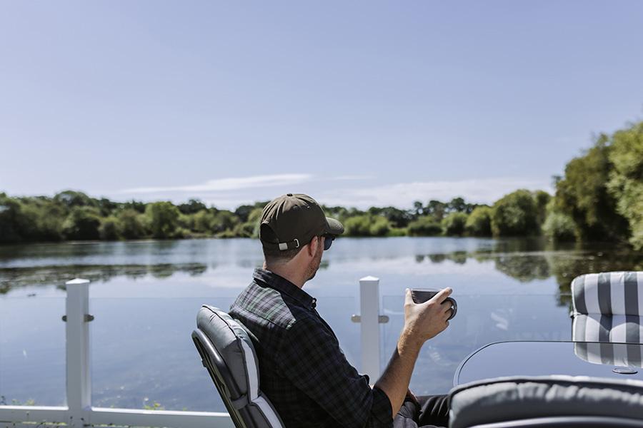 enjoying a coffee overlooking the lakes at Chichester Lakeside Holiday Park
