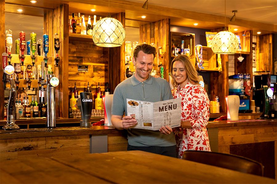 reading the menu in the restaurant