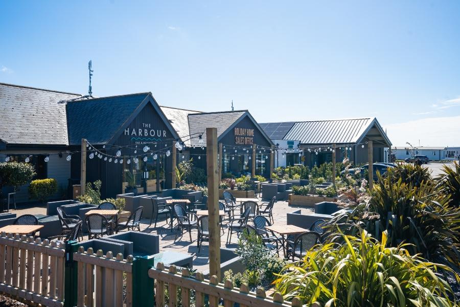 outdoor seating area at Rye Harbour Holiday Park