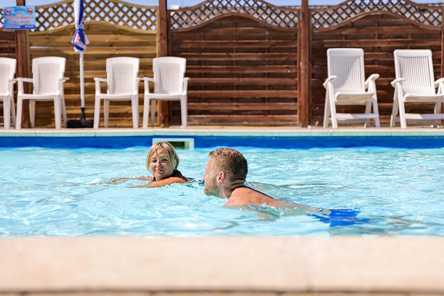 having a swim on holiday at Winchelsea Sands Holiday Park