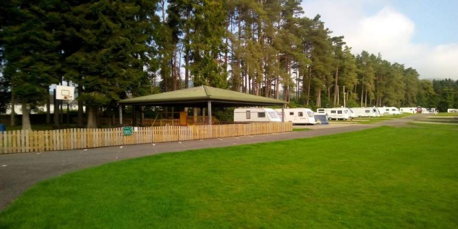 view of the grassy area at Callander Woods Holiday Park
