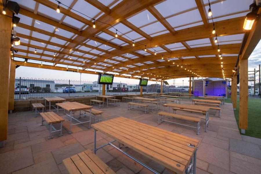 outdoor entertainment area at Cayton Bay Holiday Park