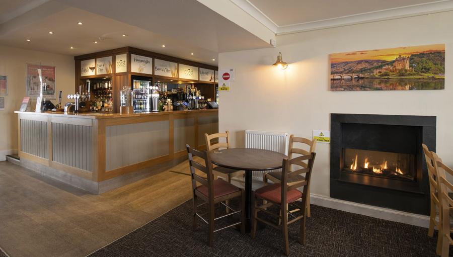 by the fire by the bar at Grannie's Heilan Hame Park