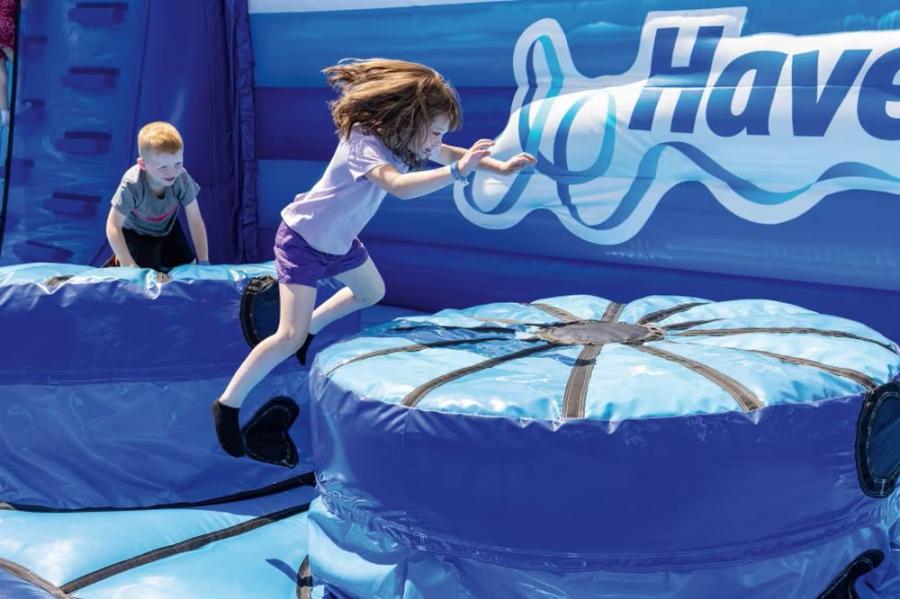 having fun on the inflatables at Primrose Valley Holiday Park