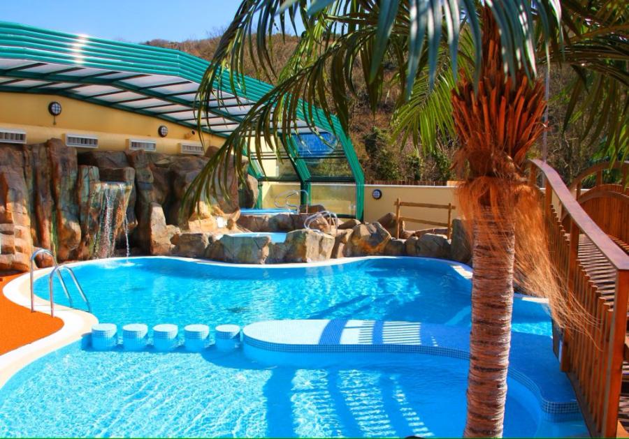 the outdoor and indoor pools at Cardigan Bay Holiday Park