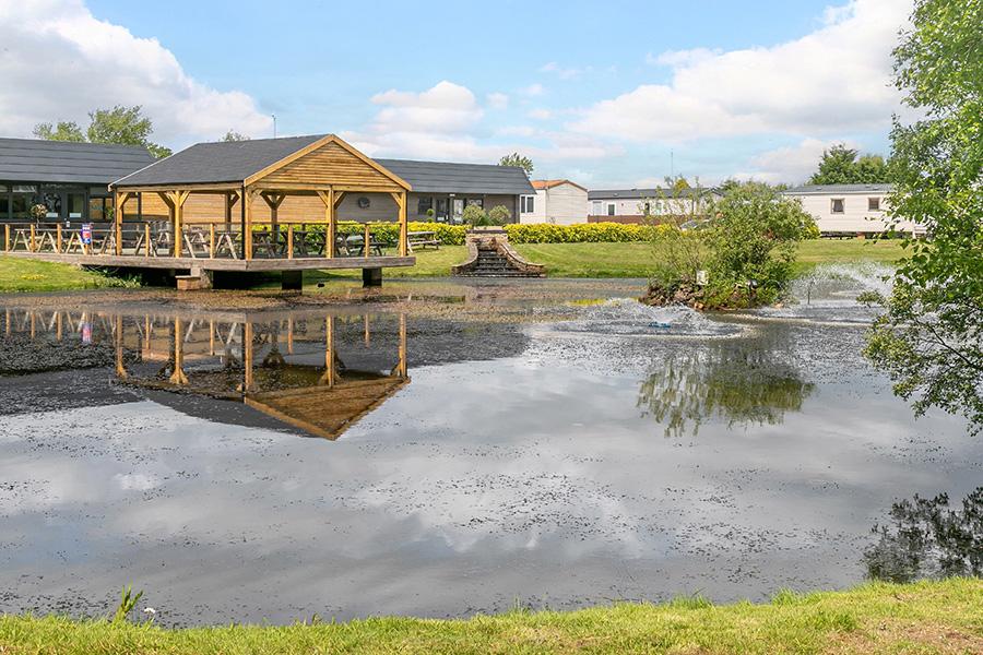 caravans by the lake at Glendale holiday park