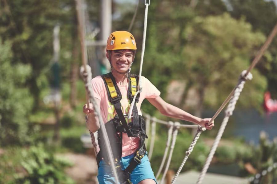 having fun on the ropes course at Hafan-Y-Mor Holiday Park
