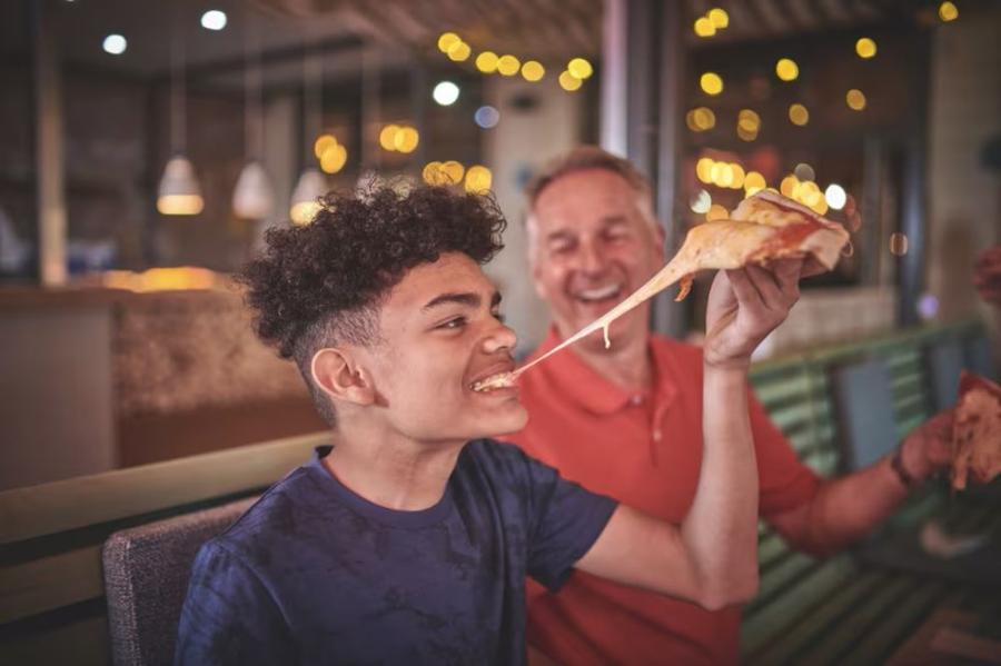 eating some pizza on holiday at Hafan-Y-Mor Holiday Park
