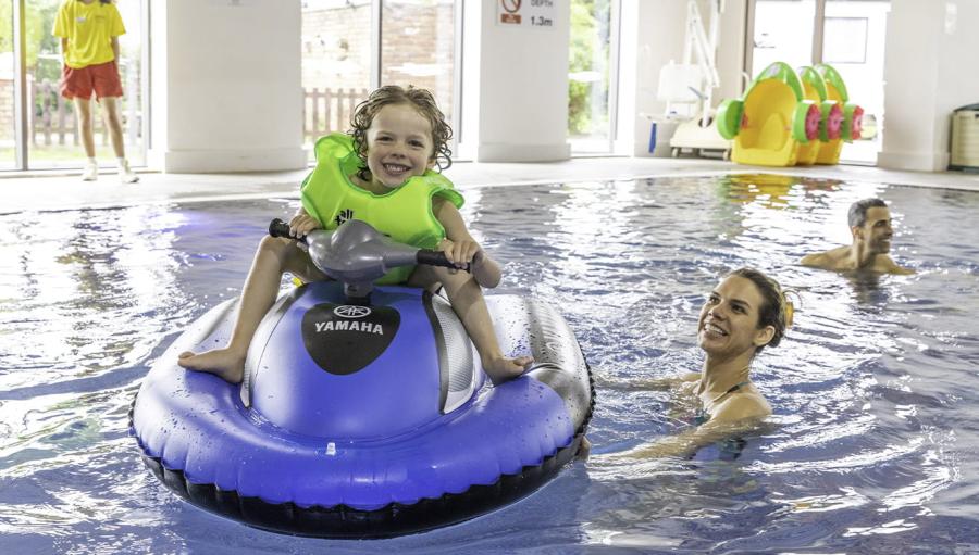 on the inflatable jet skis in the swimming pool