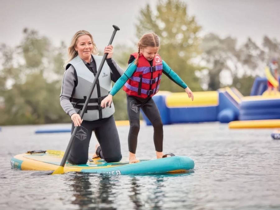 having fun on a stand up padlde board at Billing Aquadrome