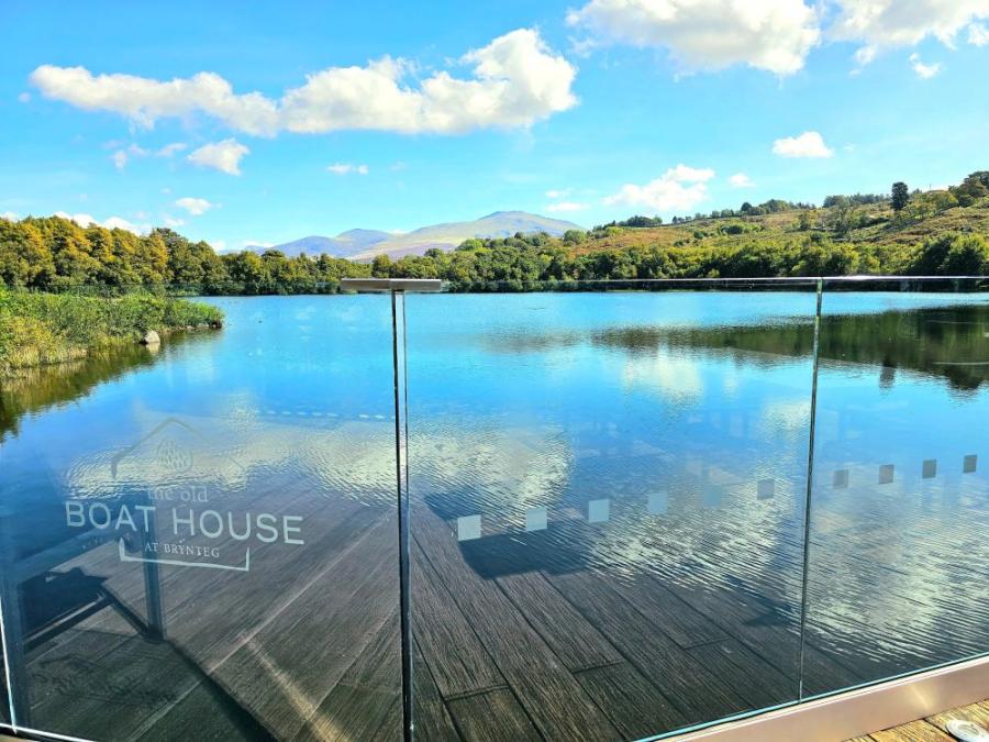 looking out from the boathouse at the lake at Brynteg Holiday Park