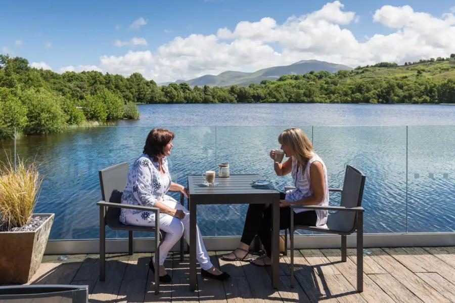 having a lunch on holiday overlooking the lake at Brynteg Holiday Park