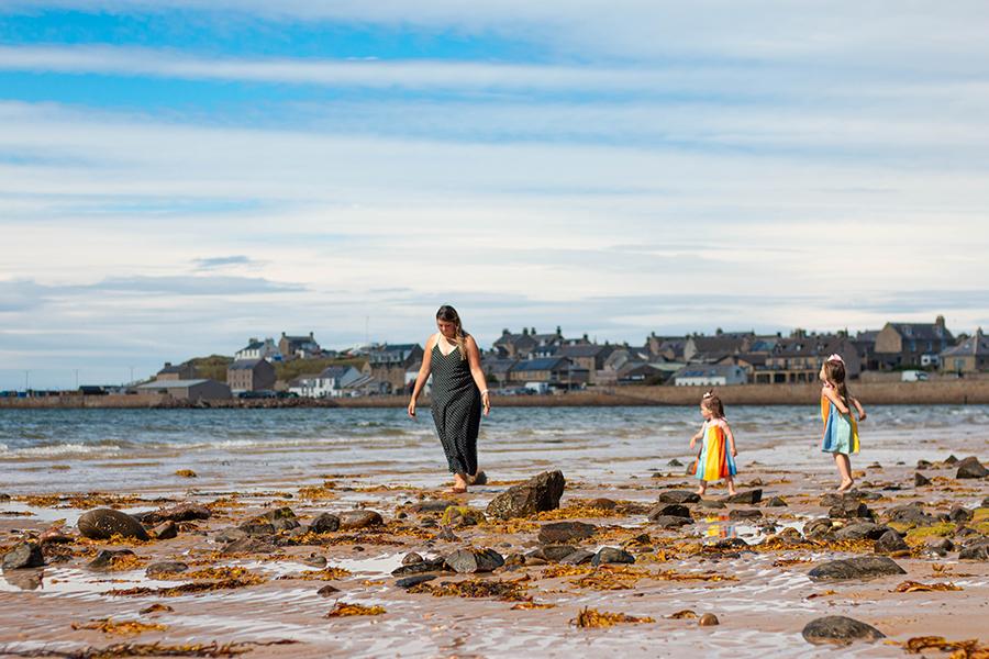 walking along the beach outside Burghead Holiday Park