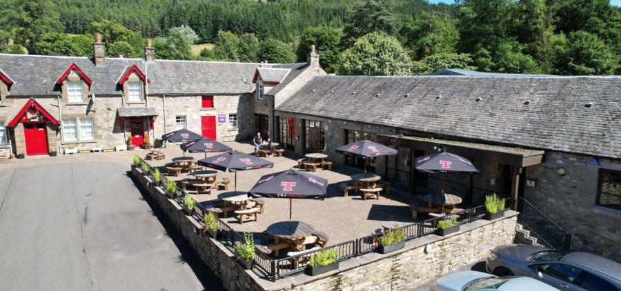 the main restaurant and bar with outside seating at Faskally Woods Holiday Park
