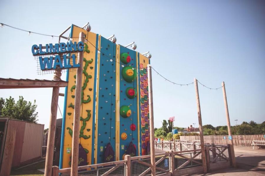 the climbing wall at the adventure park at Golden Sands Holiday Park Lincolnshire