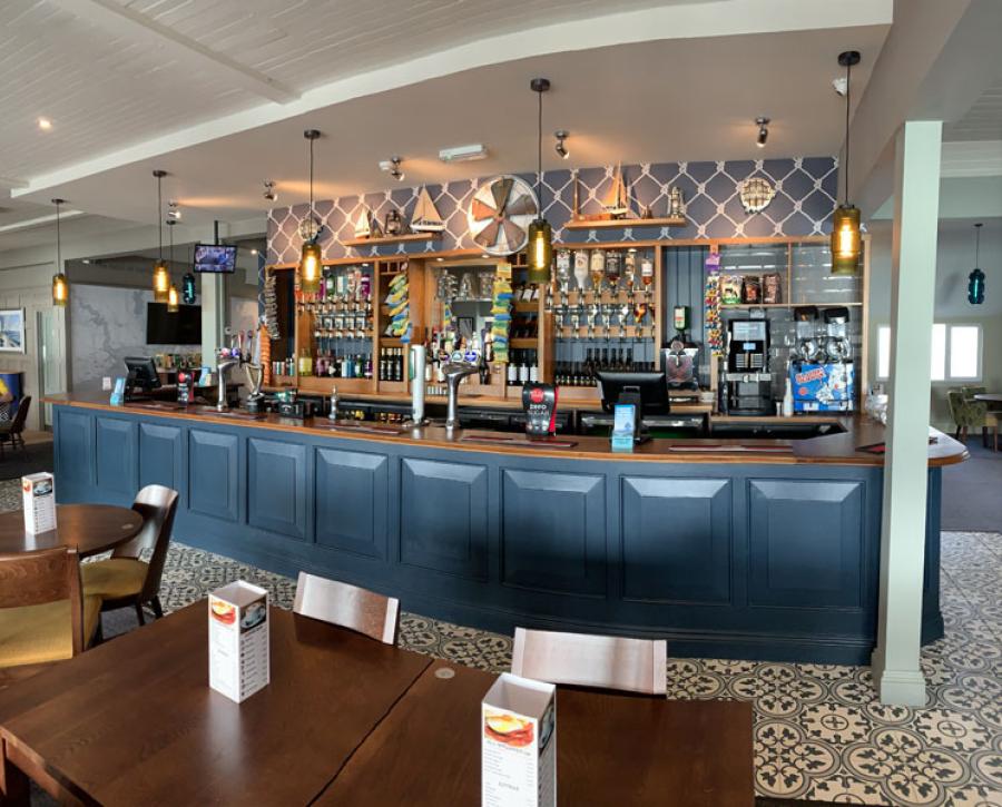 the bar with seating at Solent Breezes Holiday Park