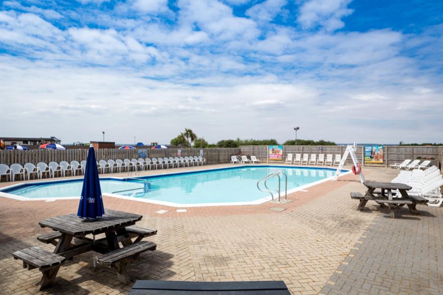 view from the outdoor swimming pool at Steeple Bay Holiday Park