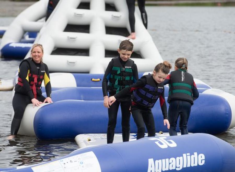 climbing on the inflatables at Tattershall Lakes Country Park