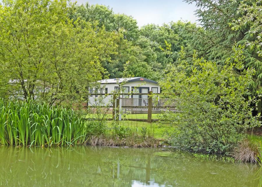 caravans by the lake at Dartmoor View Holiday Park