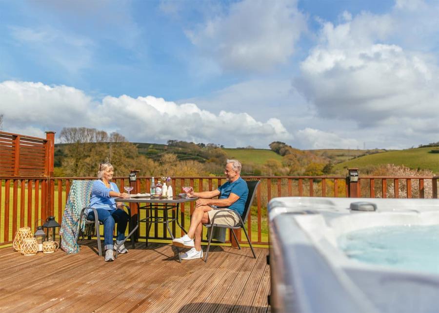 relaxing in your hot tub lodge at Devon Hills Holiday Park